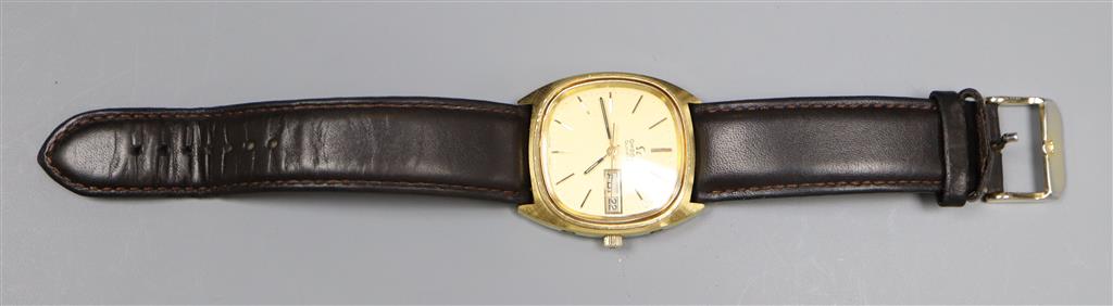 A gentlemans steel and gold plated Omega quartz day date wrist watch, on associated leather strap.